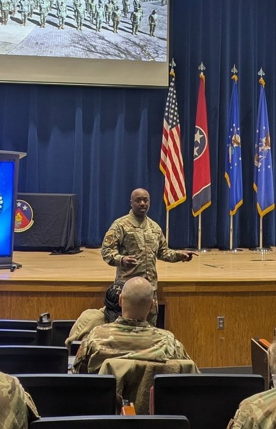 Neco Johnson leading a National Guard leadership session on stage